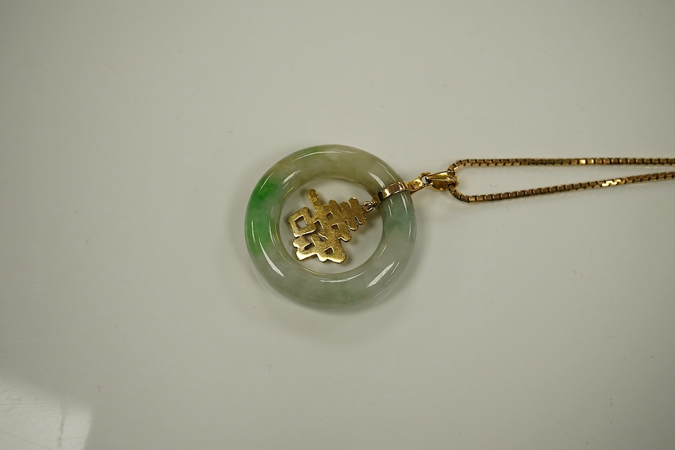 A Chinese jadeite and gold circular pendant and box link chain, stamped 585. Condition - good